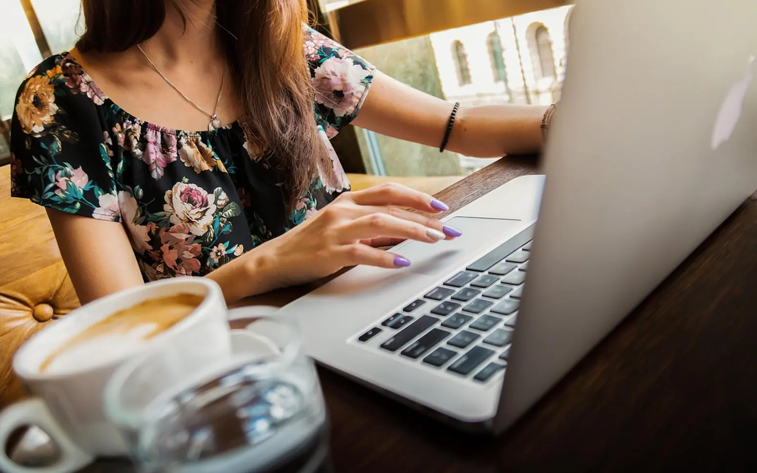 Woman, laptop and desk